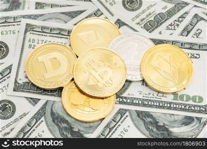 Group of cryptocurrency coin on dollar banknotes background. Cryptocurrency on US dollar bills