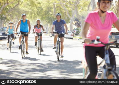 Group Of Cyclists On Suburban Street