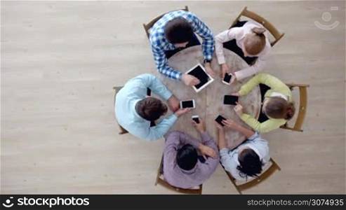 Group of diverse people using digital devices