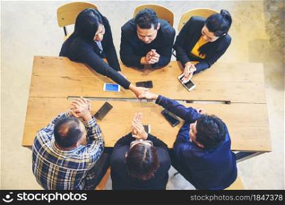 Group of diversity people fist bump holding hands together power of tag team. Teamwork Multiethnic people group working togetherness. Business people team holding hands successful. Business meeting