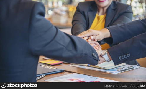 Group of diversity people fist bump holding hands together power of tag team. Teamwork Multiethnic people group working togetherness. Business people team holding hands successful. Business meeting