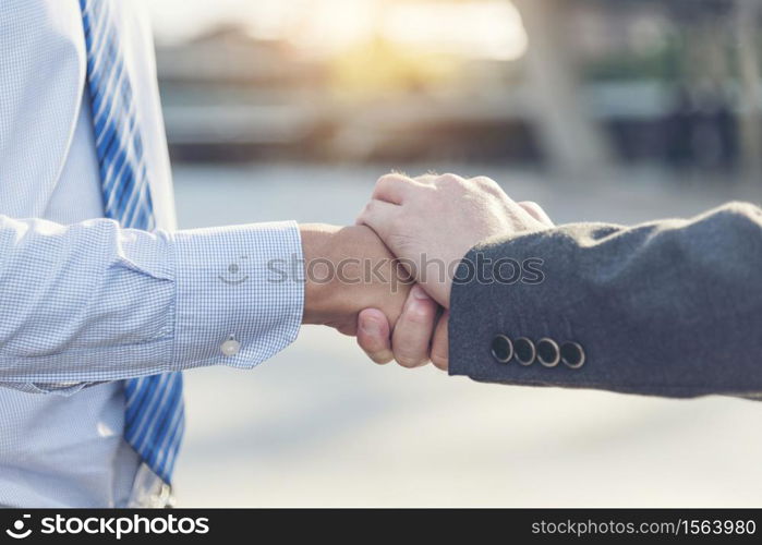 Group of diversity people with success partnership fist bump of hands together to show power and unified teams in office. Business teamwork trust in partner. Teamwork Concept.