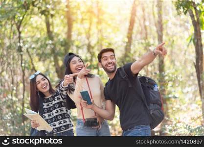 Group of Diversity Young Tourists with Backpacks over nature background. Excited Multiethnic traveler enjoying on their vacation.
