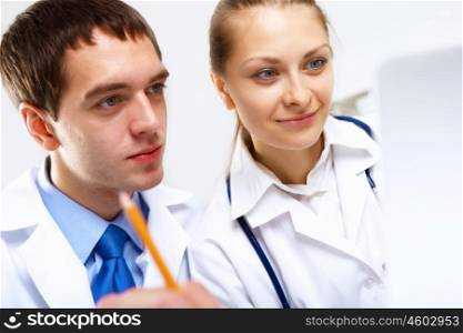 Group of doctors in uniforms together in clinic