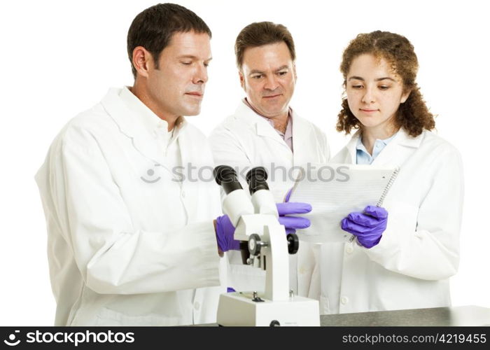 Group of doctors reading test results. Isolated on white.