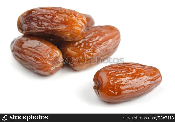 Group of dried date fruits isolated on white