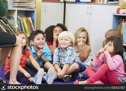Group of Elementary Pupils In Classroom Touching Noses