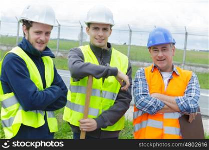 group of engineer with helmet looking confident