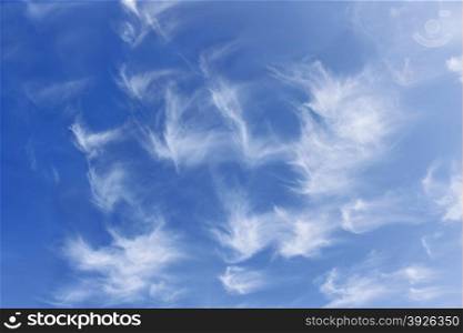 Group of fanciful white clouds against the background of blue sky