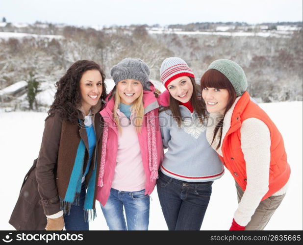 Group Of Female Friends Having Fun In Snowy Landscape