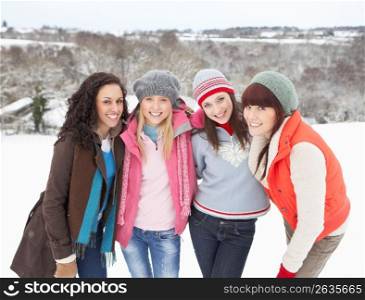 Group Of Female Friends Having Fun In Snowy Landscape