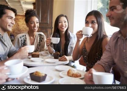 Group Of Female Friends Meeting In Cafe Restaurant