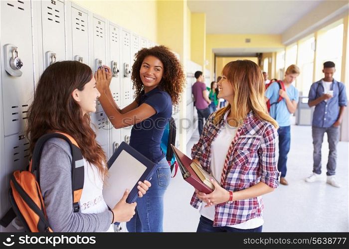 Group Of Female High School Students Talking By Lockers