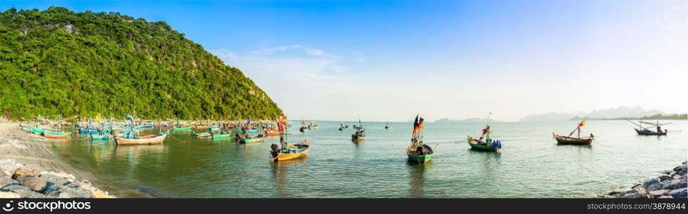 group of fishing boat anchored at Pranburi beach in Thailand