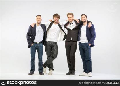 Group of four cheerful guy friends