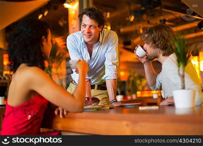 Group of friends chatting in cafe