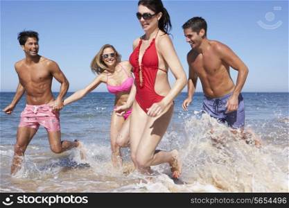 Group Of Friends Enjoying Beach Holiday