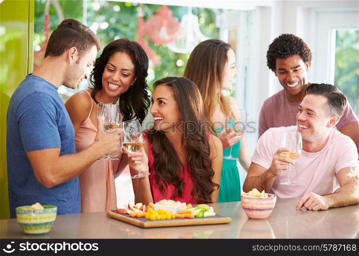 Group Of Friends Enjoying Drinks Party At Home