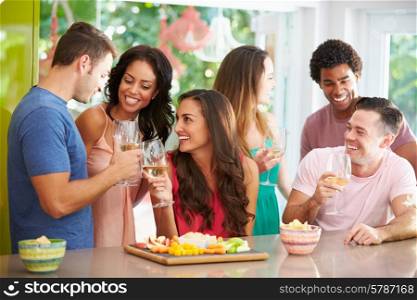 Group Of Friends Enjoying Drinks Party At Home