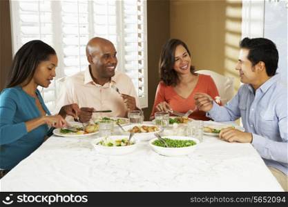 Group Of Friends Enjoying Meal At Home