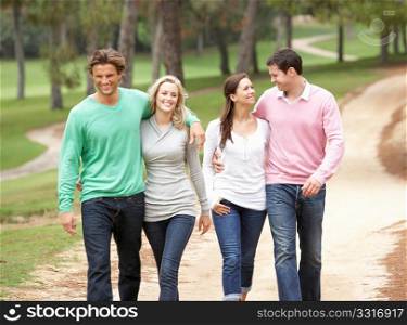 Group of friends enjoying walk in park