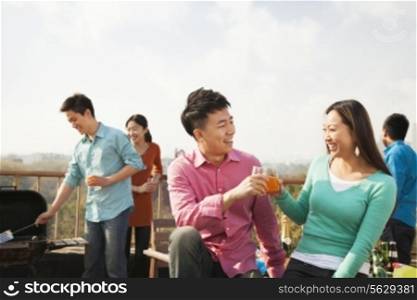 Group of Friends Having a Barbeque on a Rooftop