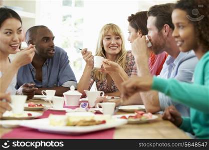 Group Of Friends Having Cheese And Coffee Dinner Party