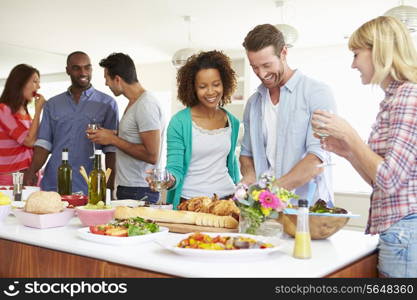 Group Of Friends Having Dinner Party At Home