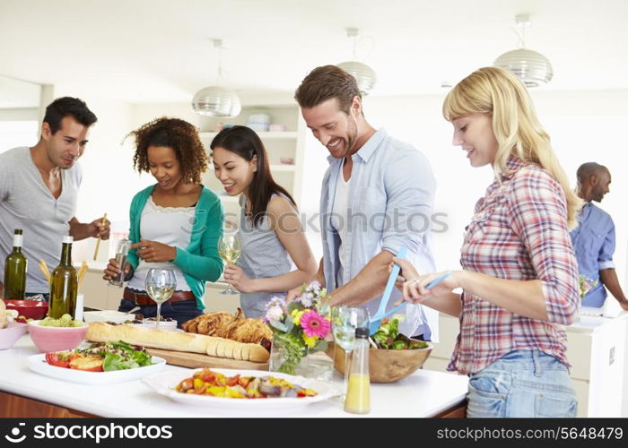 Group Of Friends Having Dinner Party At Home