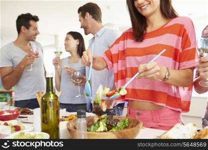 Group Of Friends Having Dinner Party At Home