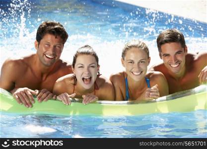 Group Of Friends Having Fun In Swimming Pool
