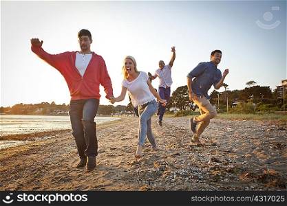 Group of friends having fun on beach