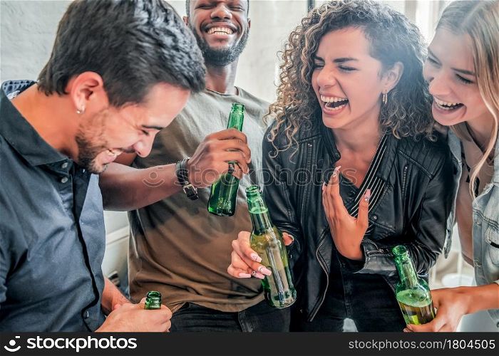 Group of friends having fun while drinking beer together. Friends concept.