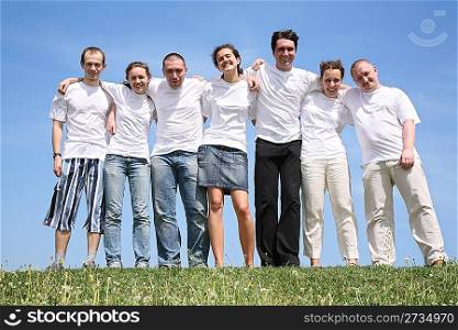 Group of friends in white T-shorts are beside