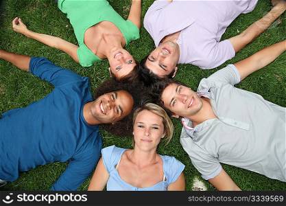 Group of friends laying down in park