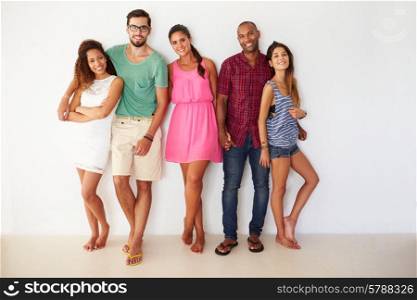 Group Of Friends Leaning Against White Wall