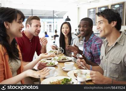 Group Of Friends Meeting For Lunch In Coffee Shop