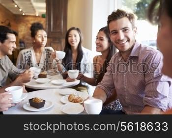 Group Of Friends Meeting In Cafe Restaurant
