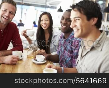 Group Of Friends Meeting In Coffee Shop