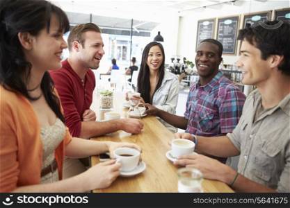 Group Of Friends Meeting In Coffee Shop