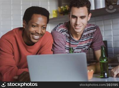 Group of friends meeting, looking at laptop and having fun. Concept of friendship.