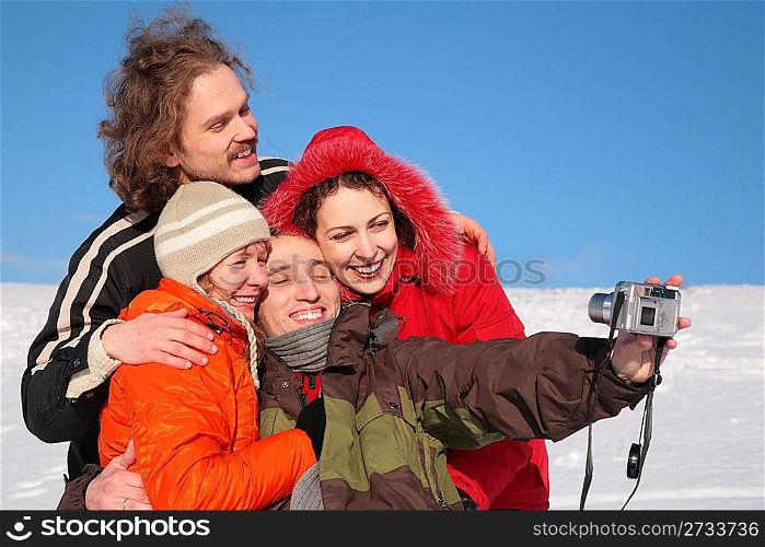 group of friends photographs itself in winter