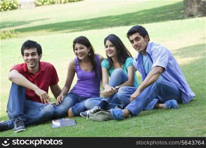 Group of friends sitting in lawn