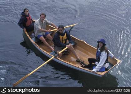 Group Of Friends Smiling From A Canoe