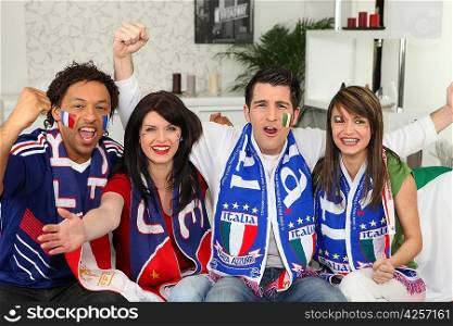 Group of friends supporting France and Italy