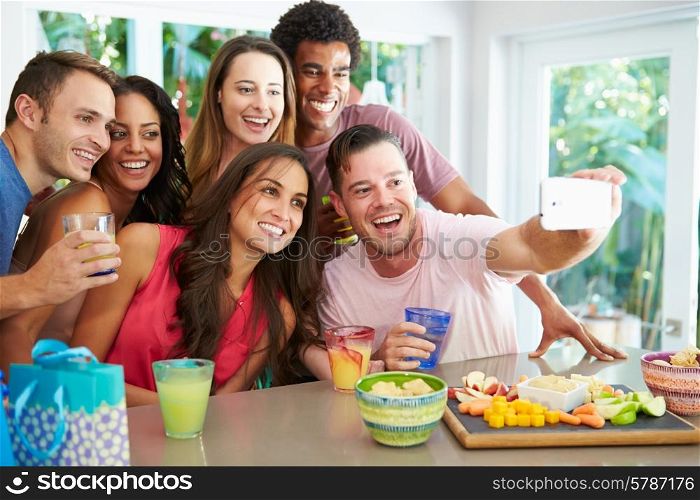 Group Of Friends Taking Selfie Whilst Celebrating Birthday