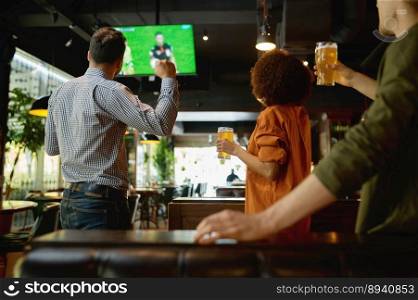 Group of friends watching football match on tv screen and drinking draft beer. Young people rest at sport bar or pub. Group of friends watching football match on tv screen at sport bar