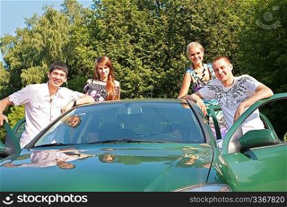 Group of friends with car outdoor