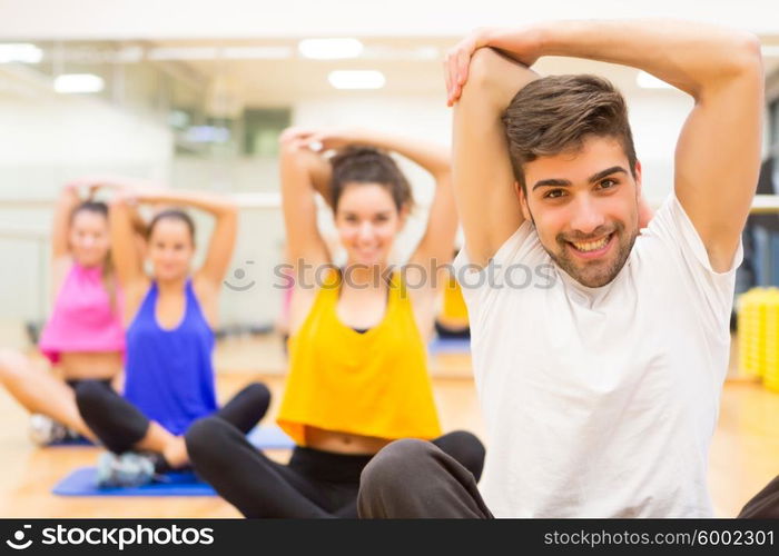 Group of friends working out at the gym