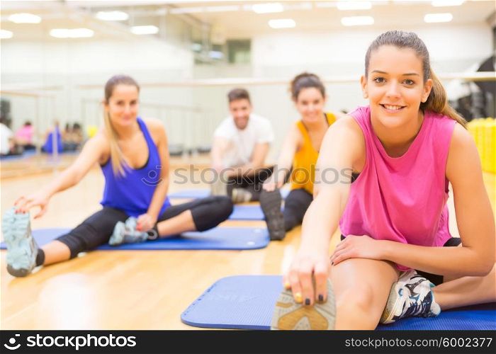 Group of friends working out at the gym
